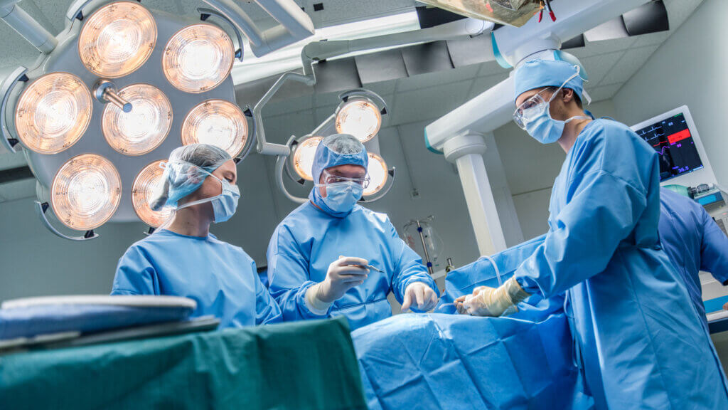 Surgeons in operating room at a healthcare facility