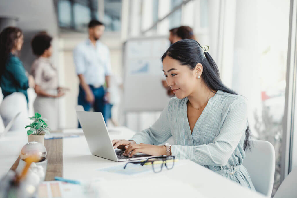 Asian Woman Working on Laptop