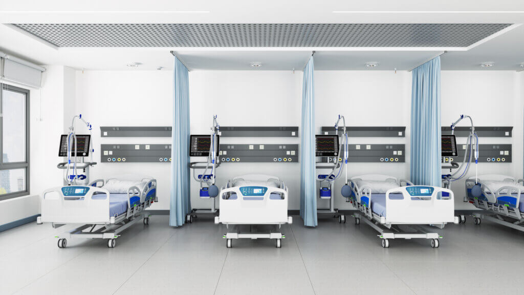 Intensive Care Unit In The Hospital With Front View Of Empty Beds.