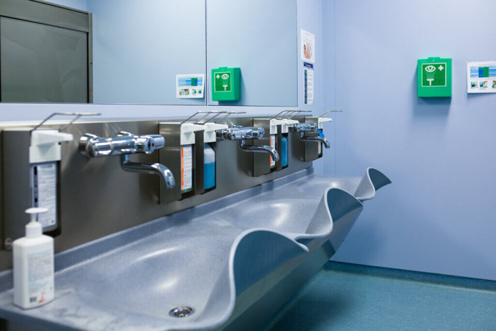 Sterile steel washbasin in modern surgery room